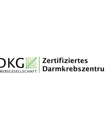 DKG logo with the text "Zertifiziertes Darmkrebszentrum," indicating certification for a colorectal cancer center.
DKG-Logo mit dem Text "Zertifiziertes Darmkrebszentrum," der die Zertifizierung eines Darmkrebszentrums anzeigt.